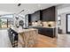 Modern kitchen with marble island and dark cabinetry at 3289 S Eudora St, Denver, CO 80222