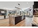 Open concept kitchen with a large marble island and stylish lighting at 3289 S Eudora St, Denver, CO 80222