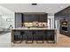 Spacious kitchen featuring a large marble island and dark wood cabinets at 3289 S Eudora St, Denver, CO 80222