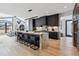 Gourmet kitchen with marble island and dark cabinetry at 3289 S Eudora St, Denver, CO 80222