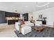 Modern living room with open floor plan and kitchen view at 3289 S Eudora St, Denver, CO 80222