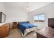 Bright bedroom with carpet, natural light, and rustic wooden furnishings at 14700 E 104Th Ave # 805, Commerce City, CO 80022
