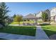 Charming community gazebo and green space near well-maintained townhomes on a sunny day at 14700 E 104Th Ave # 805, Commerce City, CO 80022