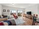 Bright living room with sliding glass doors and comfortable seating area at 14700 E 104Th Ave # 805, Commerce City, CO 80022