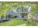 Spacious backyard with a patio, trampoline, outdoor seating and mature trees at 11303 Vernon Way, Parker, CO 80134