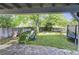 Relaxing backyard with a patio, mature trees, and a trampoline at 11303 Vernon Way, Parker, CO 80134