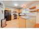 Bright kitchen featuring stainless appliances, maple cabinets, tile countertop, and a functional layout at 11303 Vernon Way, Parker, CO 80134