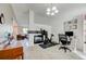 Open living room with fireplace and versatile design, offering ample space for work or leisure at 11303 Vernon Way, Parker, CO 80134