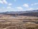 Scenic view of residential development area showcasing planned community and mountain backdrop at 15145 W Washburn Ave, Denver, CO 80228