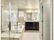 Luxurious bathroom featuring a soaking tub, walk-in shower, and vanity, designed for relaxation and elegance at 15145 W Washburn Ave, Denver, CO 80228