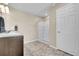 Bathroom featuring a double sink vanity, a shower/tub combination, and a white door at 20040 E 61St Dr, Aurora, CO 80019