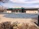 Community pool facility with covered pool and bath house in a park setting at 20040 E 61St Dr, Aurora, CO 80019