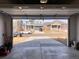 View from the garage of the home's facade, front yard, and the street at 20040 E 61St Dr, Aurora, CO 80019