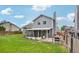 Spacious backyard with covered patio is ideal for outdoor entertaining and relaxation at 6017 S Pierson St, Littleton, CO 80127