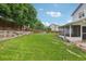 Spacious backyard with tiered landscaping and a covered patio, creating a peaceful outdoor retreat at 6017 S Pierson St, Littleton, CO 80127