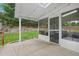 Backyard featuring a screened in porch and concrete patio at 6017 S Pierson St, Littleton, CO 80127