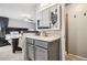 Bathroom vanity with storage and mirror adjacent the bedroom, creating a spacious layout at 6017 S Pierson St, Littleton, CO 80127
