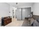 Bedroom boasts a neutral color scheme, sliding closet doors and built in dresser at 6017 S Pierson St, Littleton, CO 80127