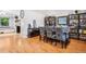 Dining room showcases a wood table with blue upholstered chairs and hardwood floors at 6017 S Pierson St, Littleton, CO 80127