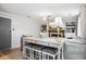 Cozy living room featuring a fireplace, built-in bookshelves, and neutral decor at 6017 S Pierson St, Littleton, CO 80127