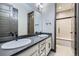 Stylish bathroom with double sinks and a large mirror at 16345 Spanish Peak Way, Broomfield, CO 80023