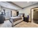 Comfortable bedroom with a large window, closet, and soft carpeting at 16345 Spanish Peak Way, Broomfield, CO 80023