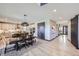 Open dining and kitchen layout with modern finishes and ample natural light at 16345 Spanish Peak Way, Broomfield, CO 80023