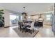 Elegant dining area with a view connecting to a modern kitchen and outdoor space at 16345 Spanish Peak Way, Broomfield, CO 80023