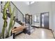 Bright foyer with a modern staircase, wood flooring, and stylish decor at 16345 Spanish Peak Way, Broomfield, CO 80023
