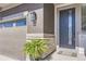 Close-up of the front door with modern details and stone accents, enhancing curb appeal at 16345 Spanish Peak Way, Broomfield, CO 80023