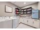 Well-equipped laundry room with modern appliances and ample storage space at 16345 Spanish Peak Way, Broomfield, CO 80023
