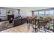 Cozy living area with a chessboard table, perfect for entertaining with scenic views at 16345 Spanish Peak Way, Broomfield, CO 80023