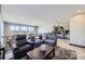 Bright open loft space with a comfortable seating area and decorative plant ladder at 16345 Spanish Peak Way, Broomfield, CO 80023