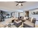 Spacious basement Gathering room with modern furniture, wet bar, and entertainment options at 16345 Spanish Peak Way, Broomfield, CO 80023