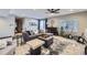 Open basement living area with stylish decor, plush seating, and natural light at 16345 Spanish Peak Way, Broomfield, CO 80023
