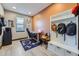 A well-lit office space with a workstation and custom storage solutions at 16345 Spanish Peak Way, Broomfield, CO 80023