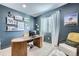 Cozy home office featuring a stylish desk, comfortable seating, and ample natural light at 16345 Spanish Peak Way, Broomfield, CO 80023