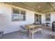 Covered patio space with string lights, dining area, and direct access to the backyard at 16345 Spanish Peak Way, Broomfield, CO 80023