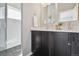 Elegant bathroom featuring a double vanity, sleek fixtures, and a walk-in shower for a spa-like experience at 2624 N Clay St, Denver, CO 80211