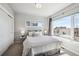 Serene bedroom with a comfortable bed, ample natural light, and contemporary design, ensuring restful nights at 2624 N Clay St, Denver, CO 80211