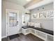 Practical mud room with a built-in bench, storage, and a bright window, seamlessly blending functionality and style at 2624 N Clay St, Denver, CO 80211