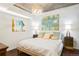 Comfortable bedroom featuring stylish lighting, modern artwork and a well-made bed at 1700 Bassett St # 314, Denver, CO 80202