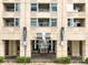 Inviting building entrance with 'Glass House' signage, enhancing curb appeal and welcoming residents at 1700 Bassett St # 314, Denver, CO 80202