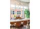 Inviting dining room featuring a long table, comfortable seating, and natural light at 1700 Bassett St # 314, Denver, CO 80202