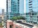 Modern high-rise building with glass balconies and common outdoor space at 1700 Bassett St # 314, Denver, CO 80202