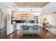 Modern kitchen with stainless steel appliances, a kitchen island and floating shelves at 1700 Bassett St # 314, Denver, CO 80202