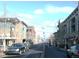 Street scene with cars parked along the side, buildings, trees and pedestrian crossing at 1948 S Balsam St, Lakewood, CO 80227