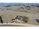 Aerial view of a construction project site shows a house foundation on a vast plot of land at 1286 Lisbon Dr, Parker, CO 80138