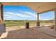Covered patio showcasing scenic views, wood columns, and a plank ceiling ready to be customized at 1286 Lisbon Dr, Parker, CO 80138