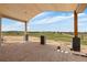 Expansive covered patio with natural wood accents, beautiful views, and ample space to entertain at 1286 Lisbon Dr, Parker, CO 80138